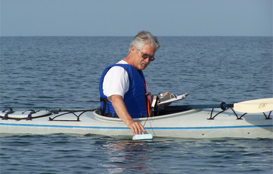 Professor working in kayak