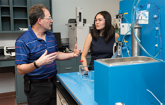 Student and Professor working in lab