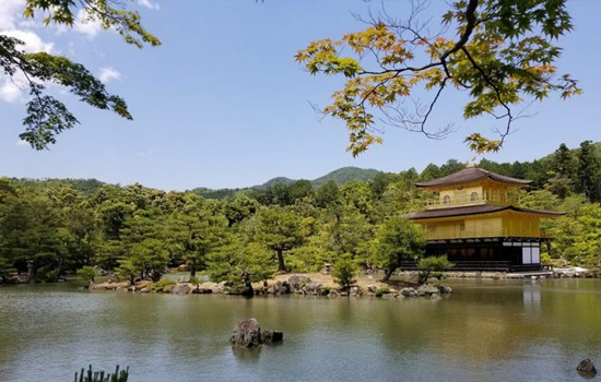 a Japanese structure near a body of water.