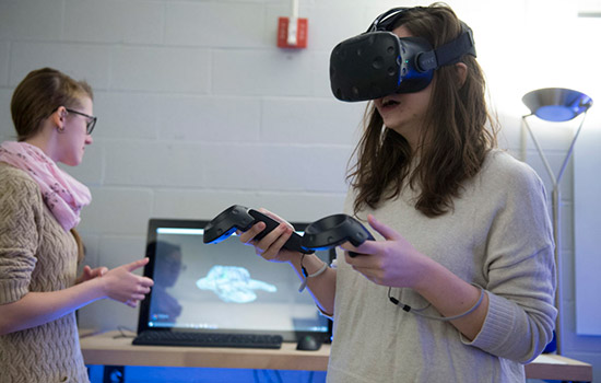 Person using virtual reality device in classroom
