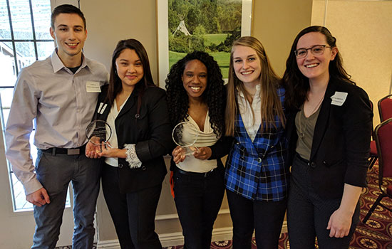 The two winning teams for RIT pose together for a photo.