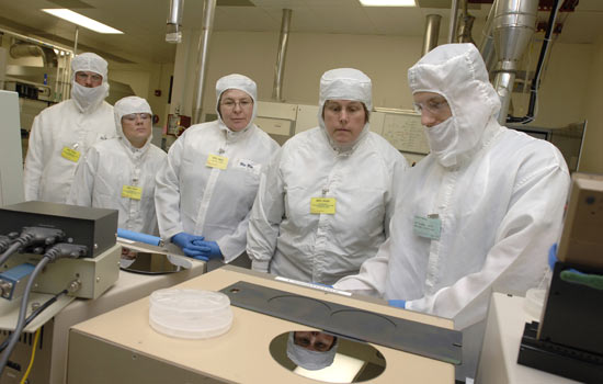 Teachers observing manufacturing process