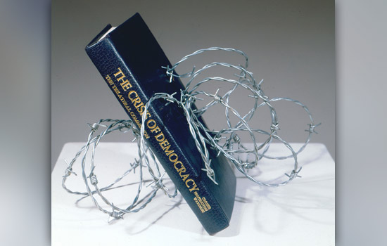 Book wrapped up in barbed wire