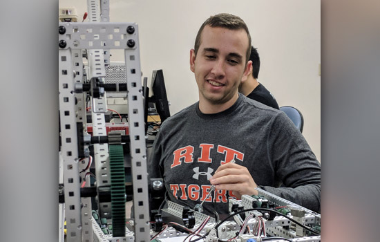 Shane Murphy works on a robot.