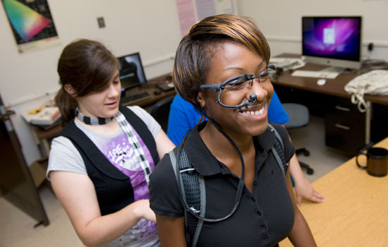 People using gadget in lab