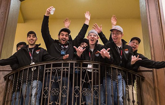 Team posing on balcony