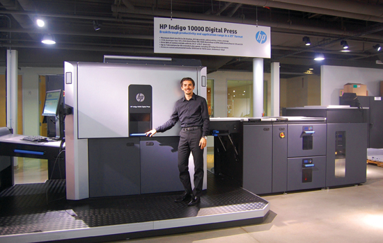 Person posing with printers