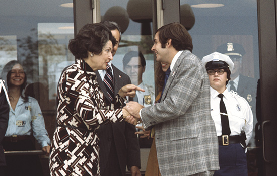 Lady Bird Johnson shaking hands with Bill Ingraham.