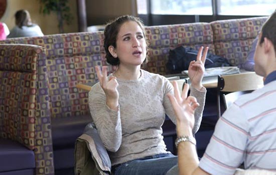Two students conversing in Sign Language