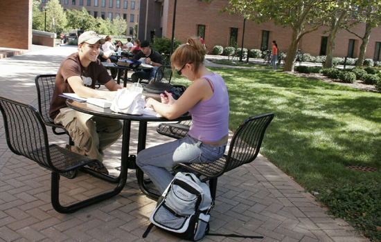 Students eating at tables in Quad