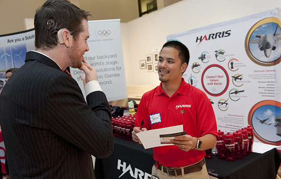Student talking to person at career fair