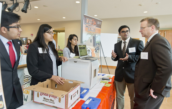 Students showing project to reviewers
