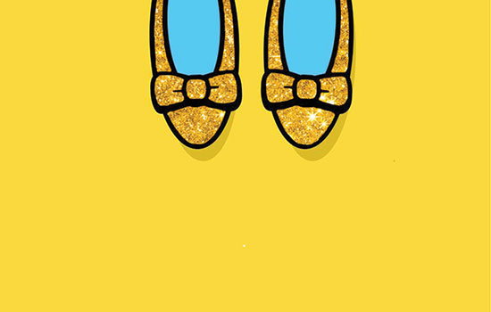 Yellow glittery flat shoes with bows on them.