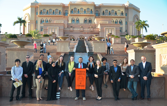 group of college students standing outside the Palace Hotel.