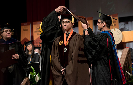 Graduate Students being awarded for efforts