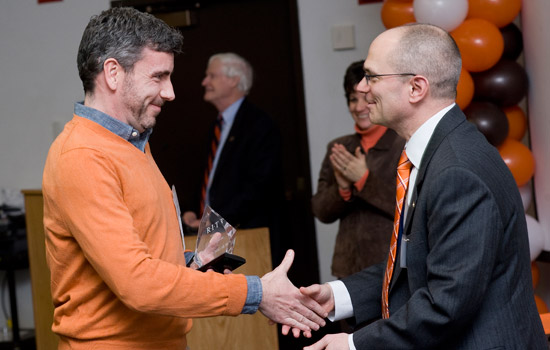 People shaking hands at event