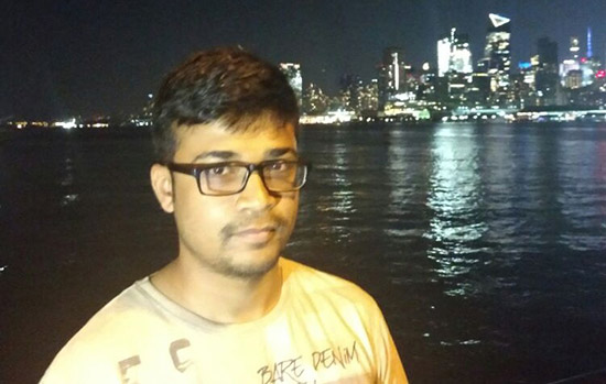 Pratik Shirish Kulkarni in front of a city skyline.