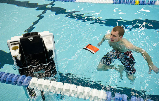 Person swimming with robot 