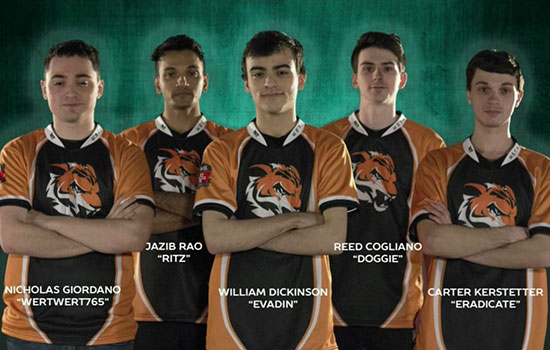 RIT esports team poses for picture wearing matching jerseys.