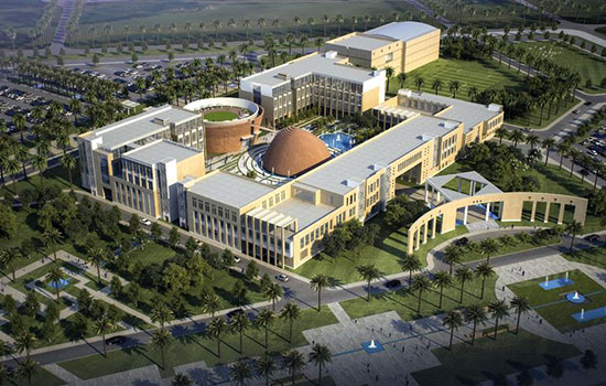 Aerial image of building surrounded by greenery.