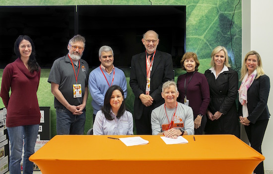 Nine representatives from RIT and Foodlink pose for a photo together.