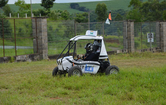 Person driving kart on path