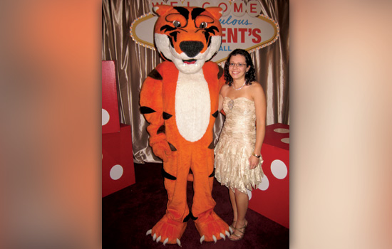 Person posing with tiger mascot