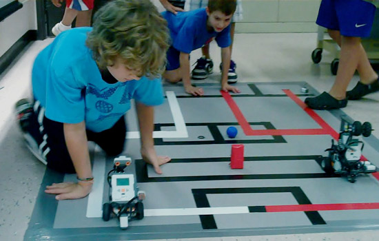 Kids playing with robots