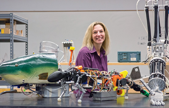 Person posing with Robotic fish 