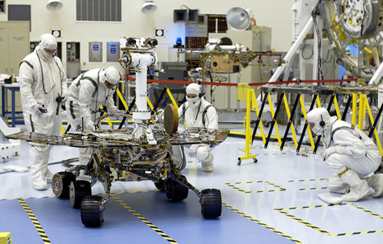 People working on rover in lab
