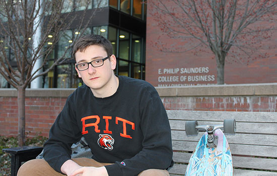Portrait of Nathan Raw outside of Saunders college of business.