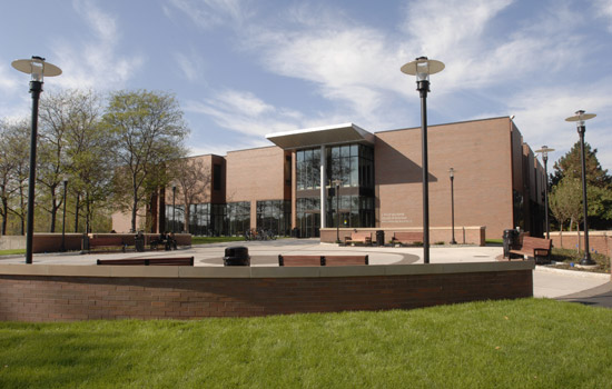 Saunders College of Business brick building on RIT campus.