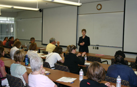 Professor teaching in front of classroom