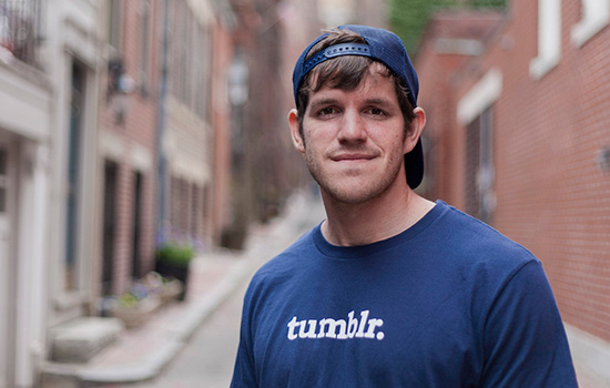 Brandon Stanton standing in a New York City alley.