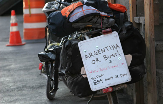 Picture of bike with "Argentina or Bust!" sign