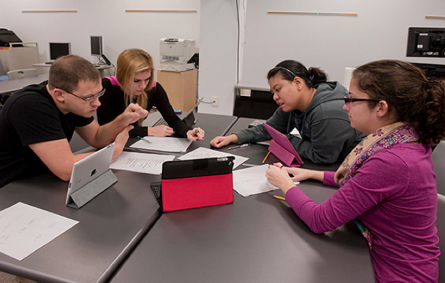 People working on problem in classroom