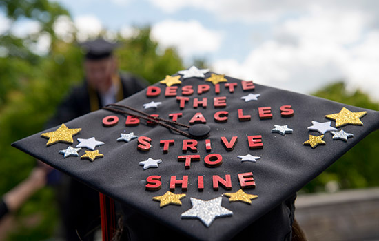 Picture of Graduate cap displaying "Despite the Obstacles Strive to Shine"