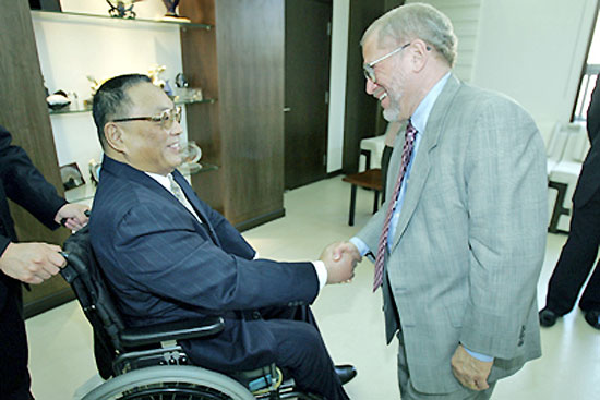 Professor and chairperson shaking hands