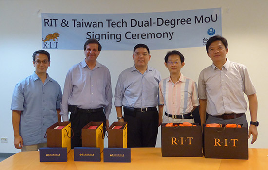 Five professors posing in front of "RIT & Taiwan Tech Dual-Degree MoU signing Ceremony"