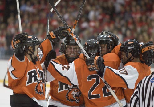 RIT Hockey players huddling together