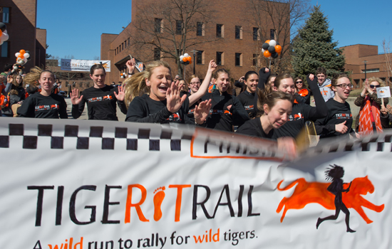 People running into "Tiger Trail" banner
