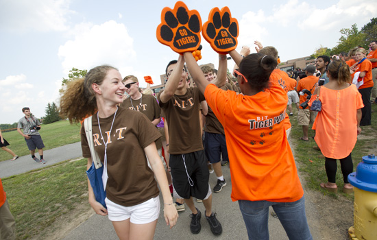 People wearing RIT shirts gathered at event