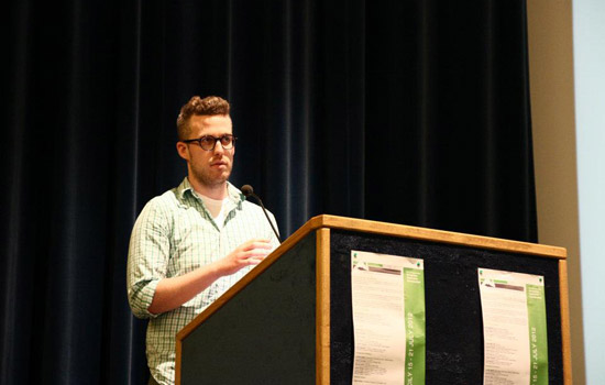 Person giving speech at podium