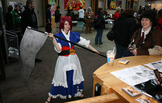 Person posing in costume at event