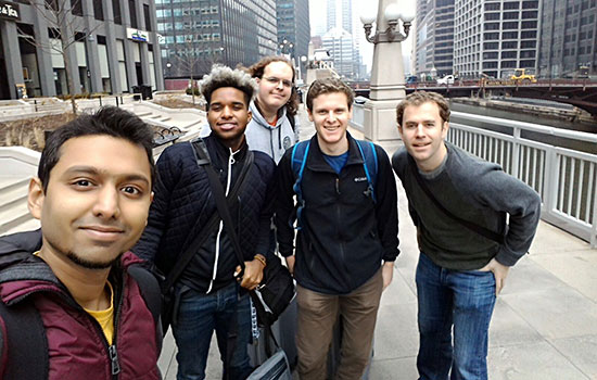 People gathered for picture on pathway in city