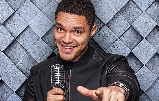 Trevor Noah pointing toward camera