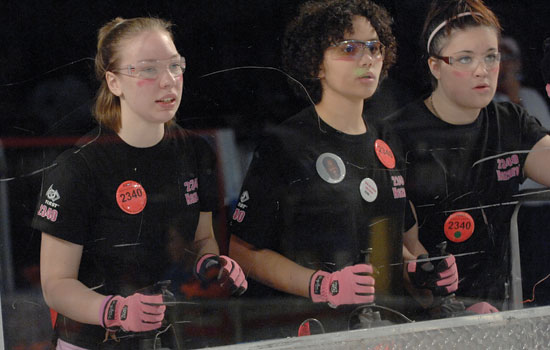 Students controlling a device at an event