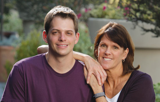 Student standing with parent