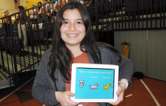 Person holding tablet displaying three animals