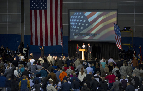 People gathered around flag